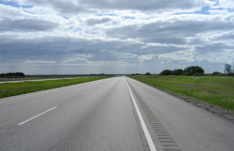 a smoothly paved highway stretching into the horizon
