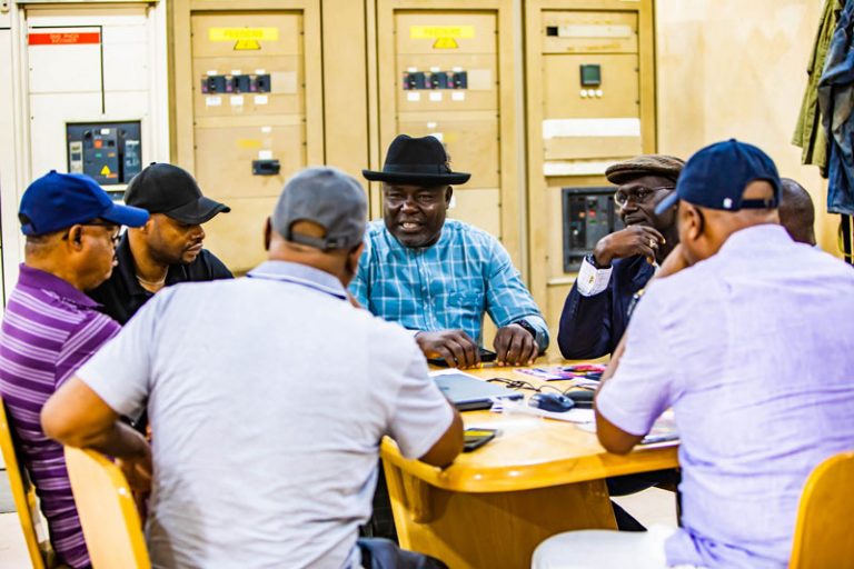 Engr. Tony Amechi in a meetingm with staffers of Woodland Wood Factory