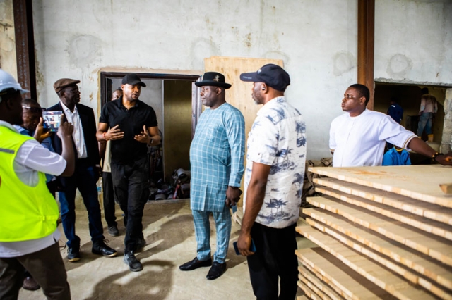 Engr. Tony Amechi listending to Woodland Wood Factory Site Managers explanations